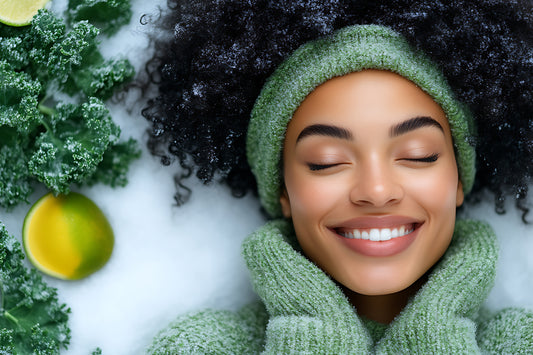 A woman with curly hair wearing a green sweater smiles warmly, radiating joy and positivity in snow winter.