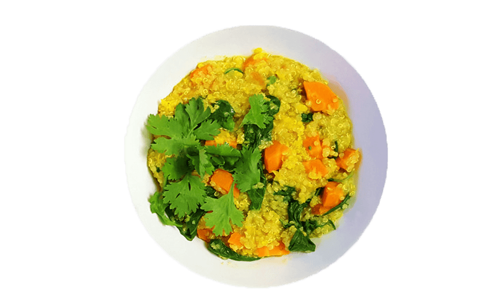 Yellow quinoa and vegetables in a bowl