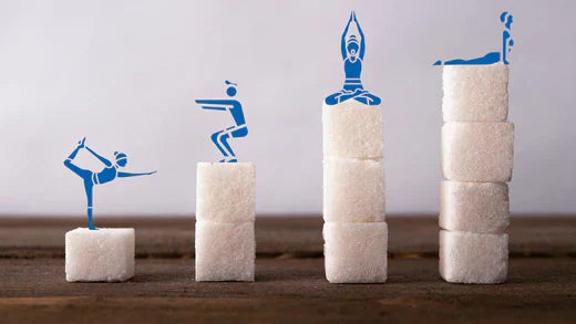 Sugar cubes featuring miniature figures atop them, all outlined in blue, creating a whimsical and artistic composition.