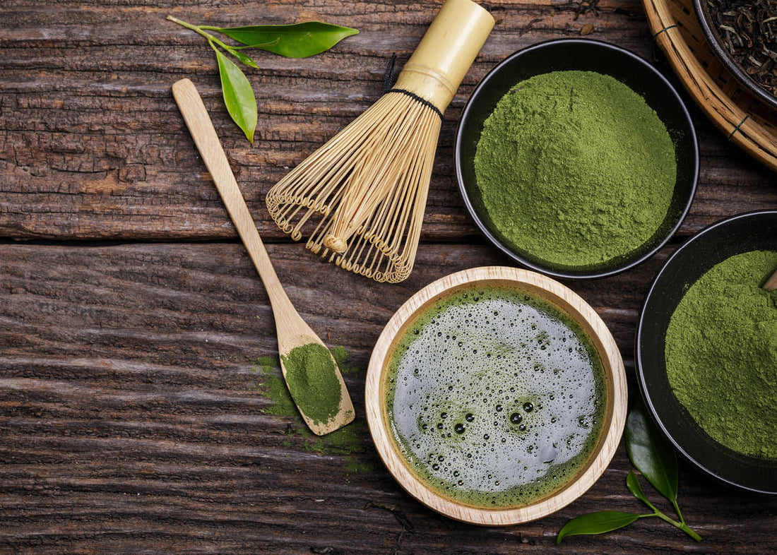 A close-up view of vibrant matcha green tea powder in a small bowl, showcasing its rich color and fine texture.